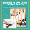 Inflatable crib wedge placed under crib mattress nursery setup